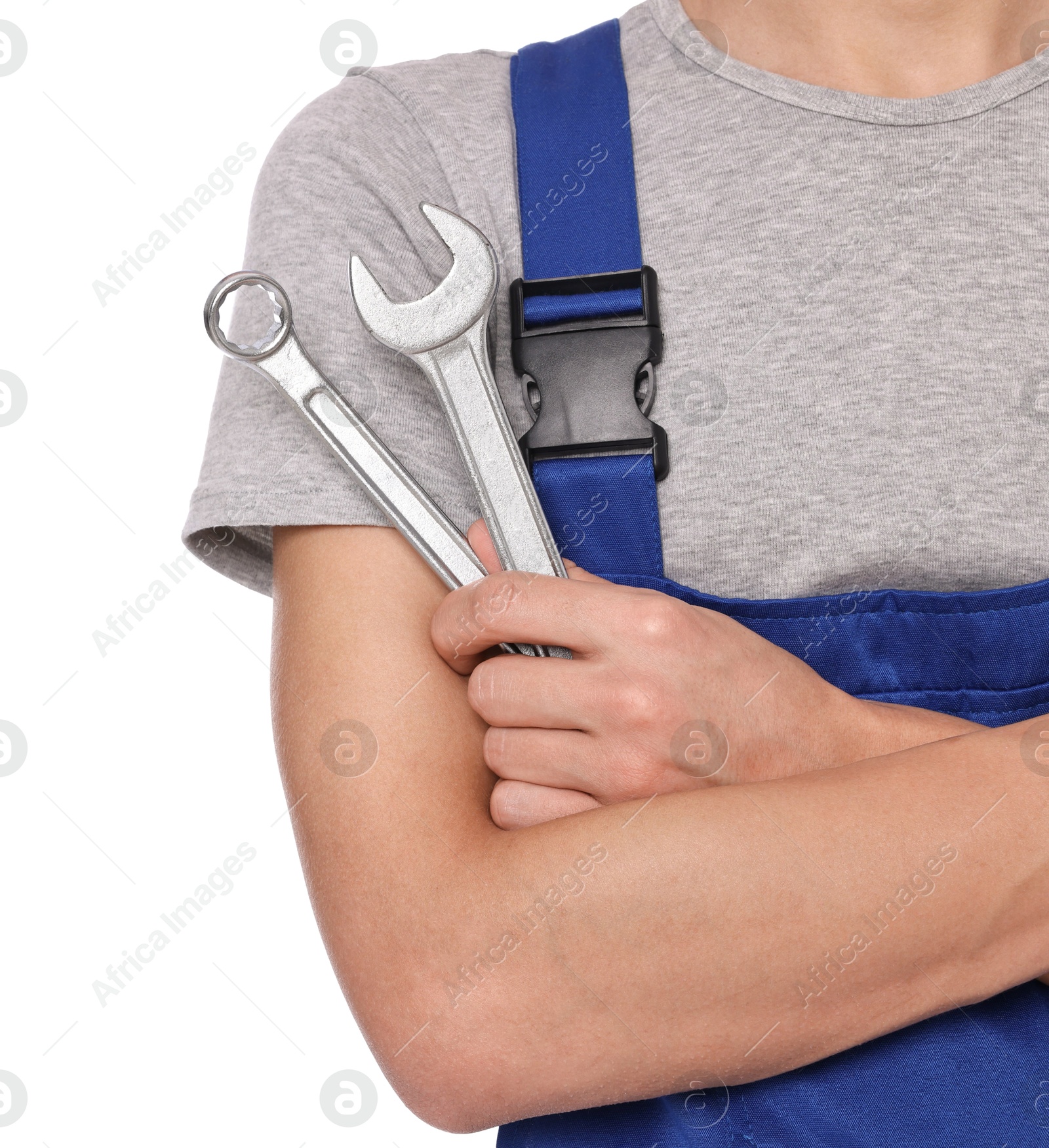 Photo of Auto mechanic with wrenches on white background, closeup