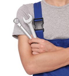 Photo of Auto mechanic with wrenches on white background, closeup