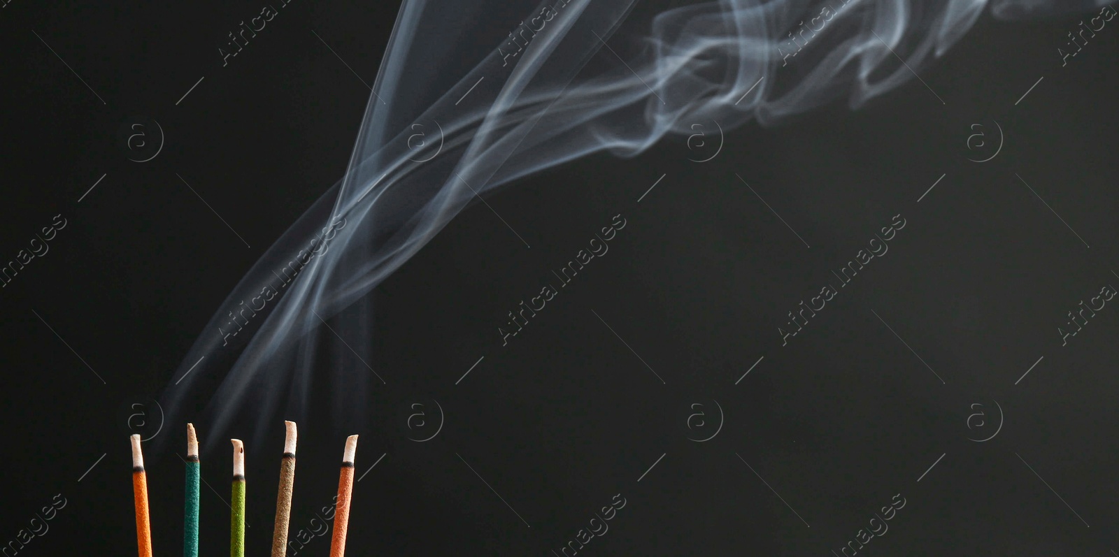 Photo of Aromatic incense sticks smoldering on black background, space for text. Banner design