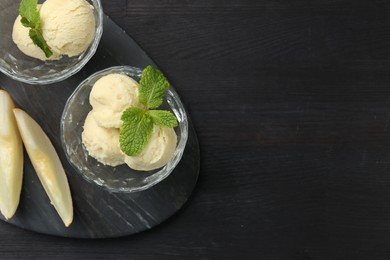 Scoops of melon sorbet with mint in glass dessert bowls and fresh fruit on dark wooden table, flat lay. Space for text