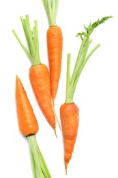 Photo of Tasty ripe juicy carrots isolated on white, top view