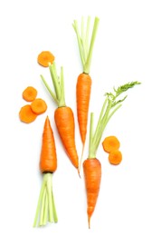 Photo of Whole and cut fresh carrots isolated on white, top view