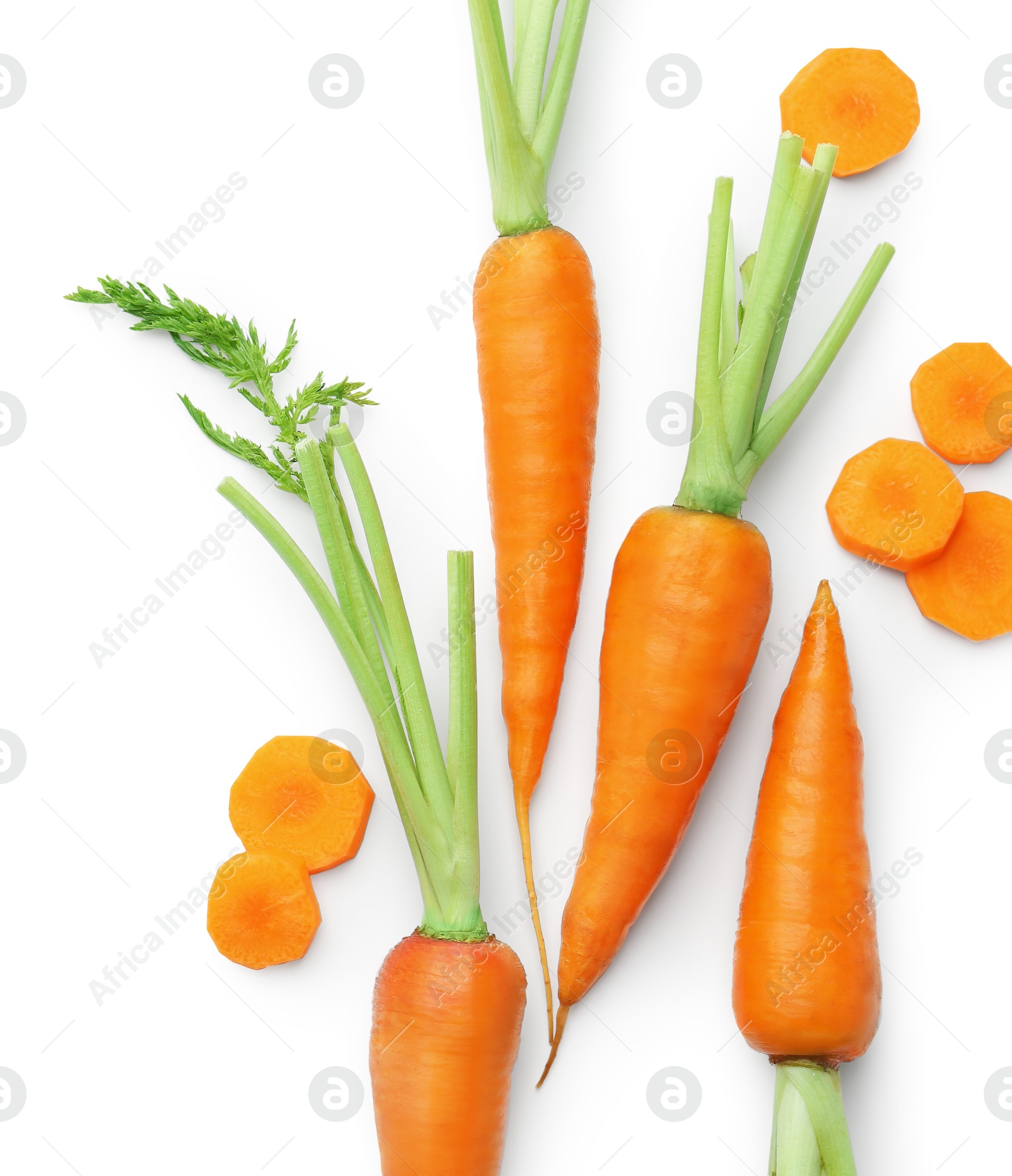 Photo of Whole and cut fresh carrots isolated on white, top view