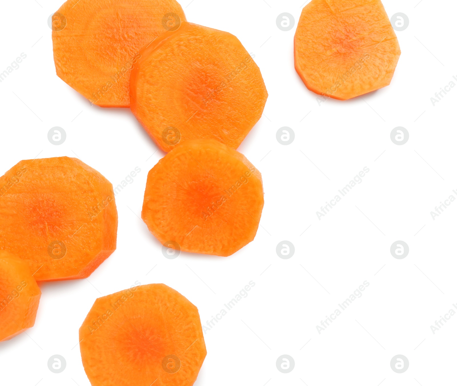 Photo of Slices of fresh ripe carrot isolated on white, top view