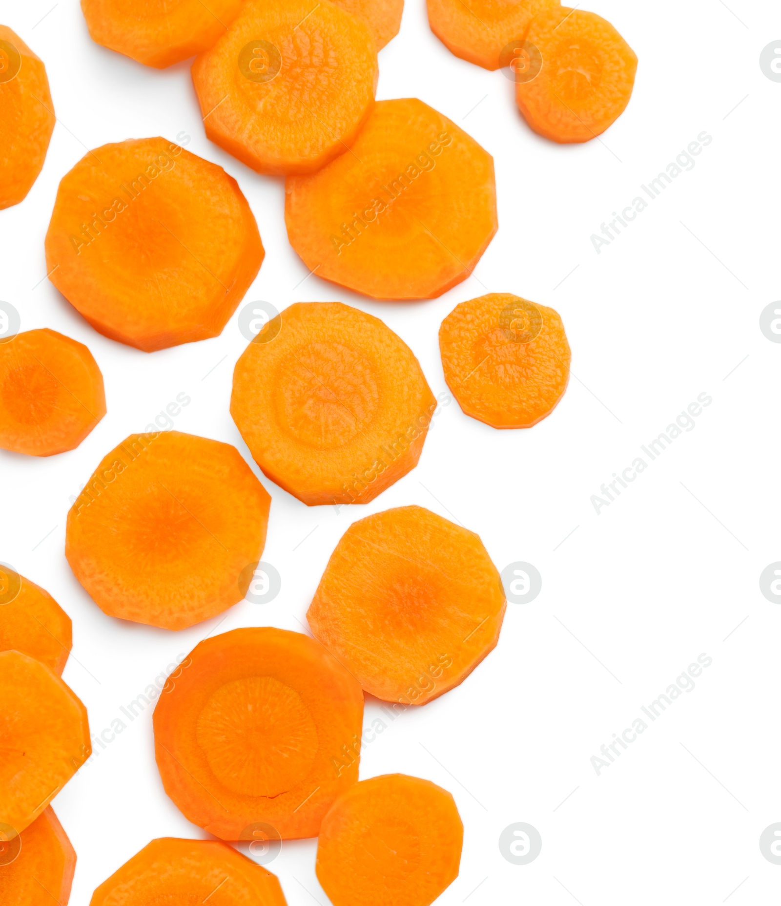 Photo of Slices of fresh ripe carrot isolated on white, top view