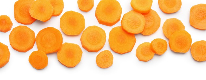 Photo of Slices of fresh ripe carrot isolated on white, top view