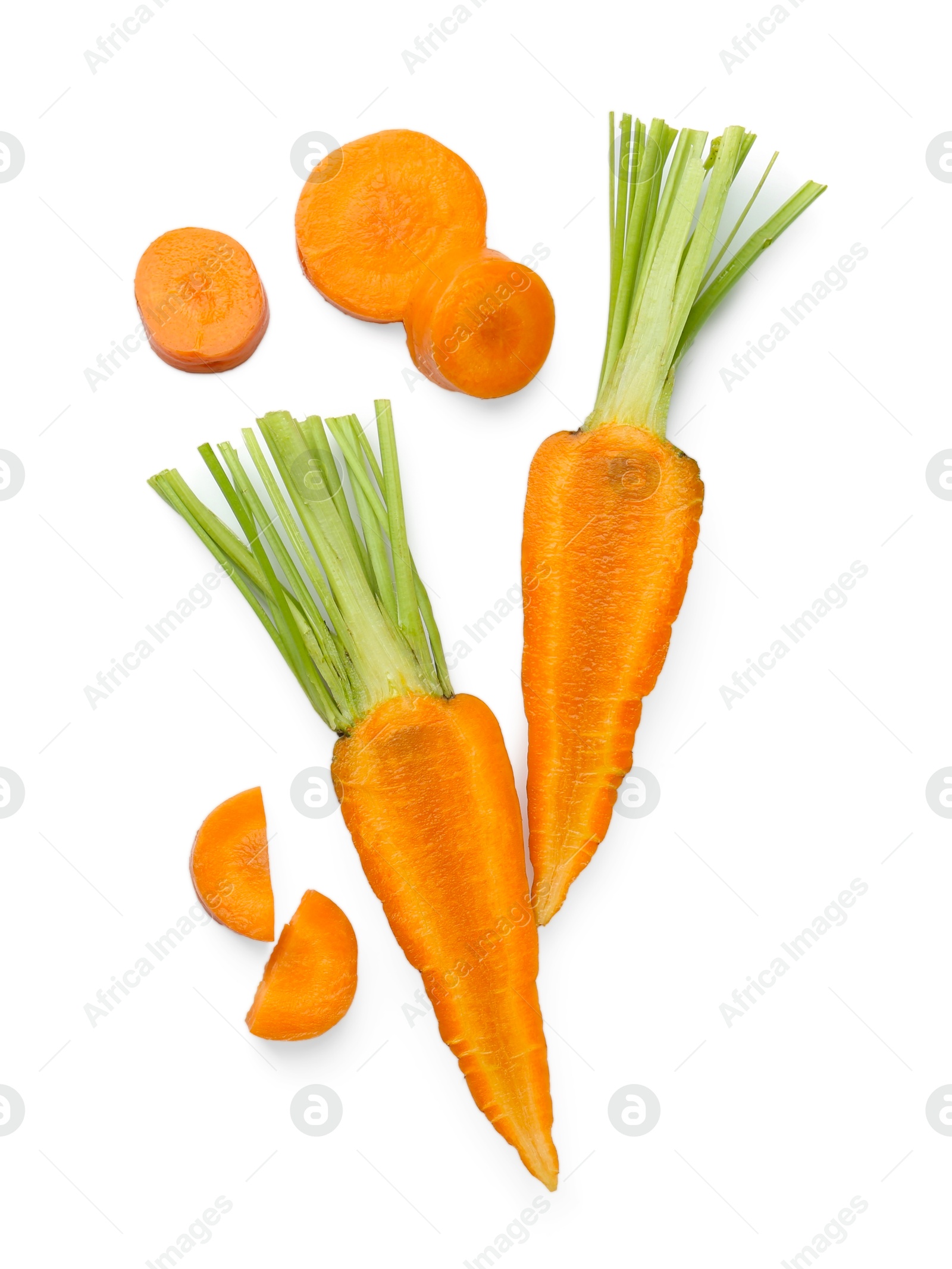 Photo of Whole and cut fresh carrots isolated on white, top view