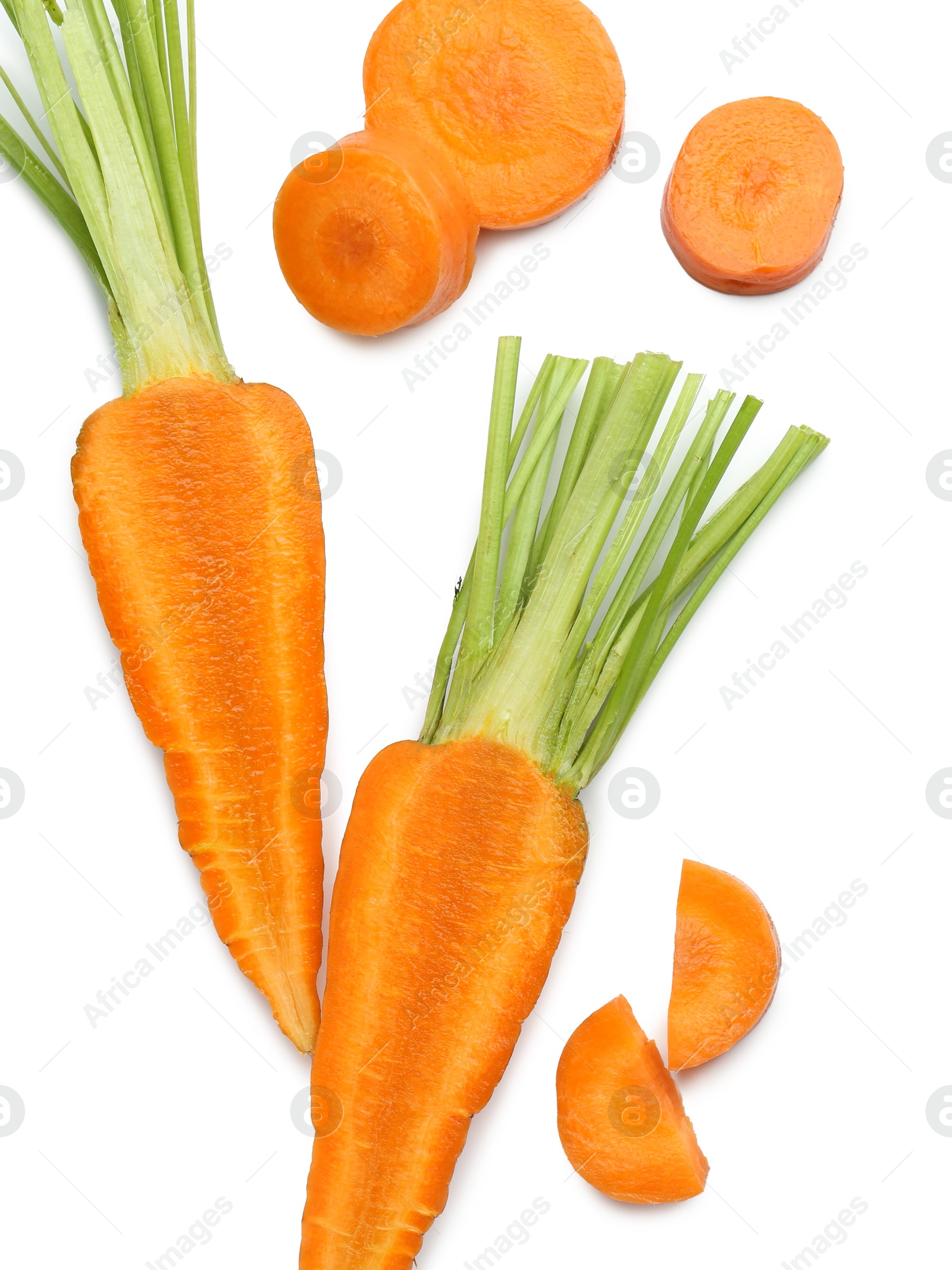 Photo of Whole and cut fresh carrots isolated on white, top view