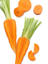 Whole and cut fresh carrots isolated on white, top view