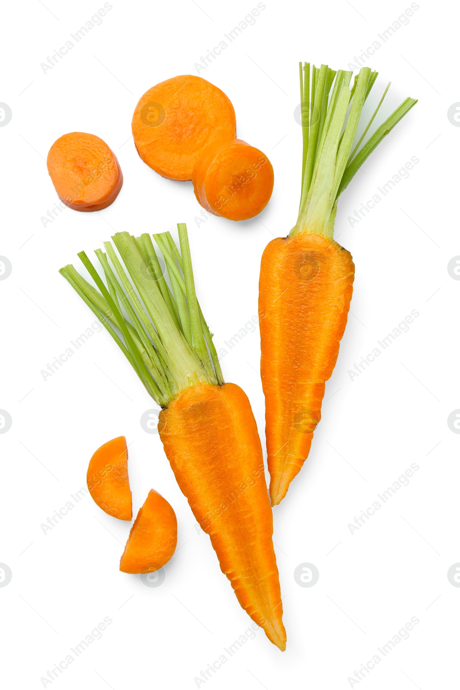 Photo of Whole and cut fresh carrots isolated on white, top view