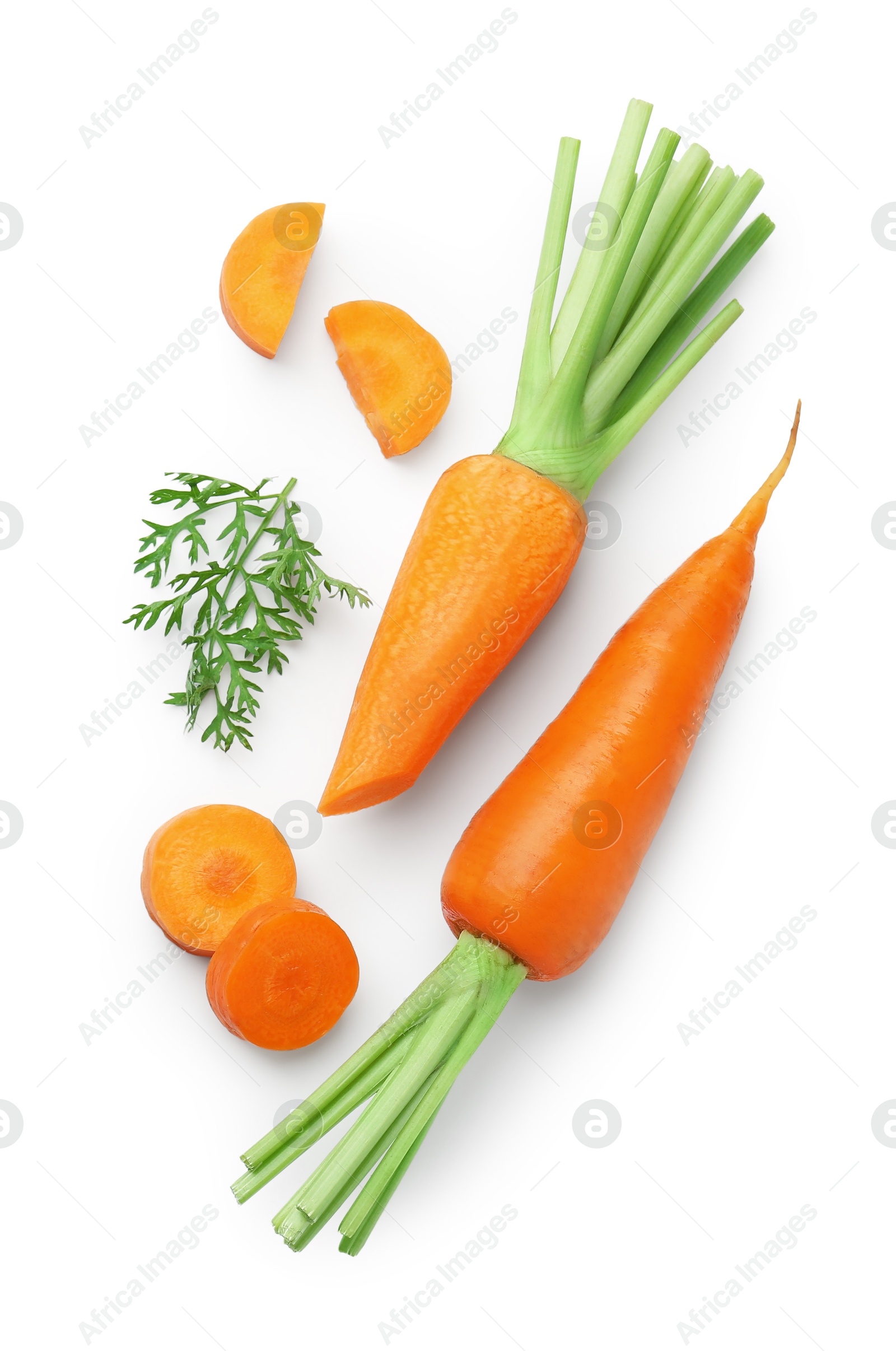 Photo of Whole and cut fresh carrots isolated on white, top view