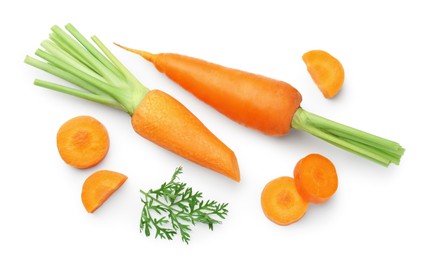 Photo of Whole and cut fresh carrots isolated on white, top view