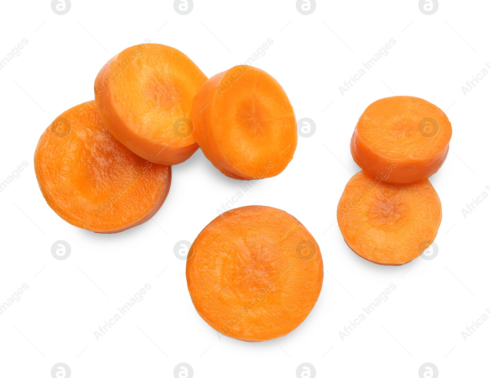 Photo of Slices of fresh ripe carrot isolated on white, top view