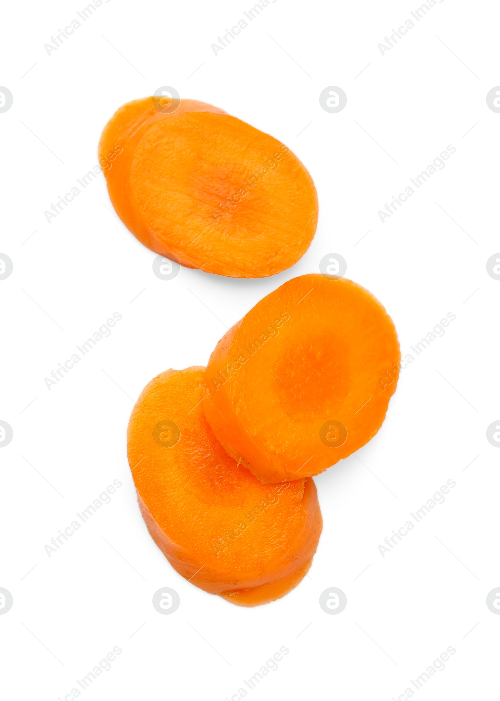 Photo of Slices of fresh ripe carrot isolated on white, top view