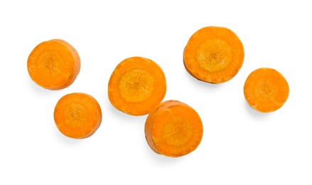 Photo of Slices of fresh ripe carrot isolated on white, top view