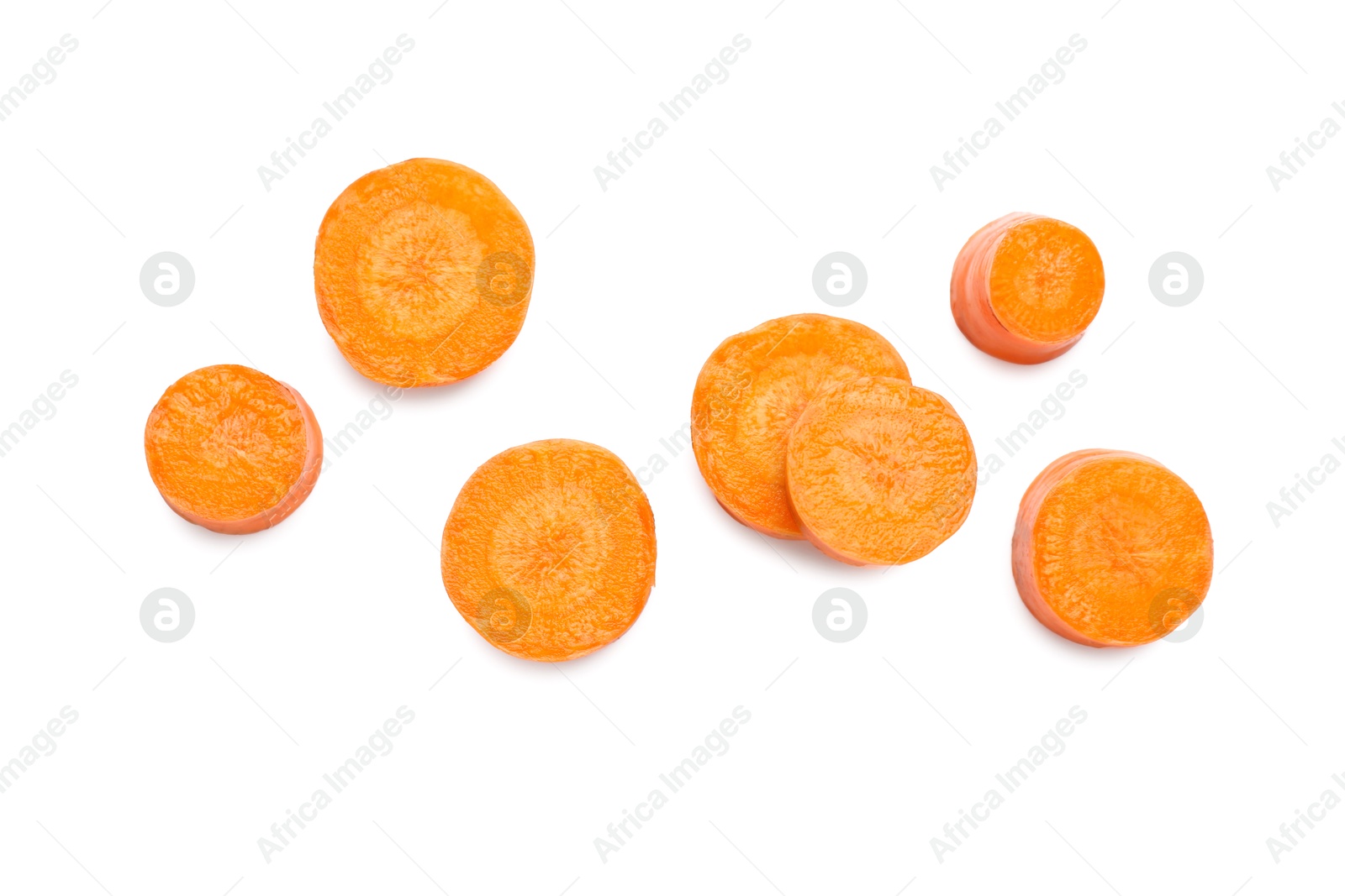 Photo of Slices of fresh ripe carrot isolated on white, top view