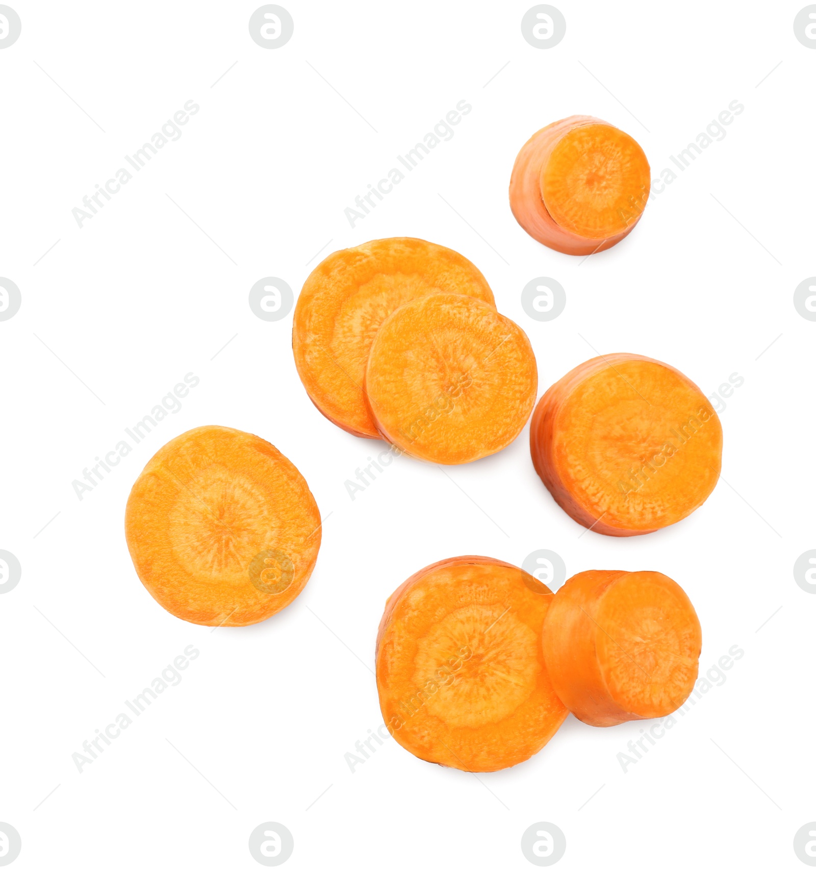 Photo of Slices of fresh ripe carrot isolated on white, top view