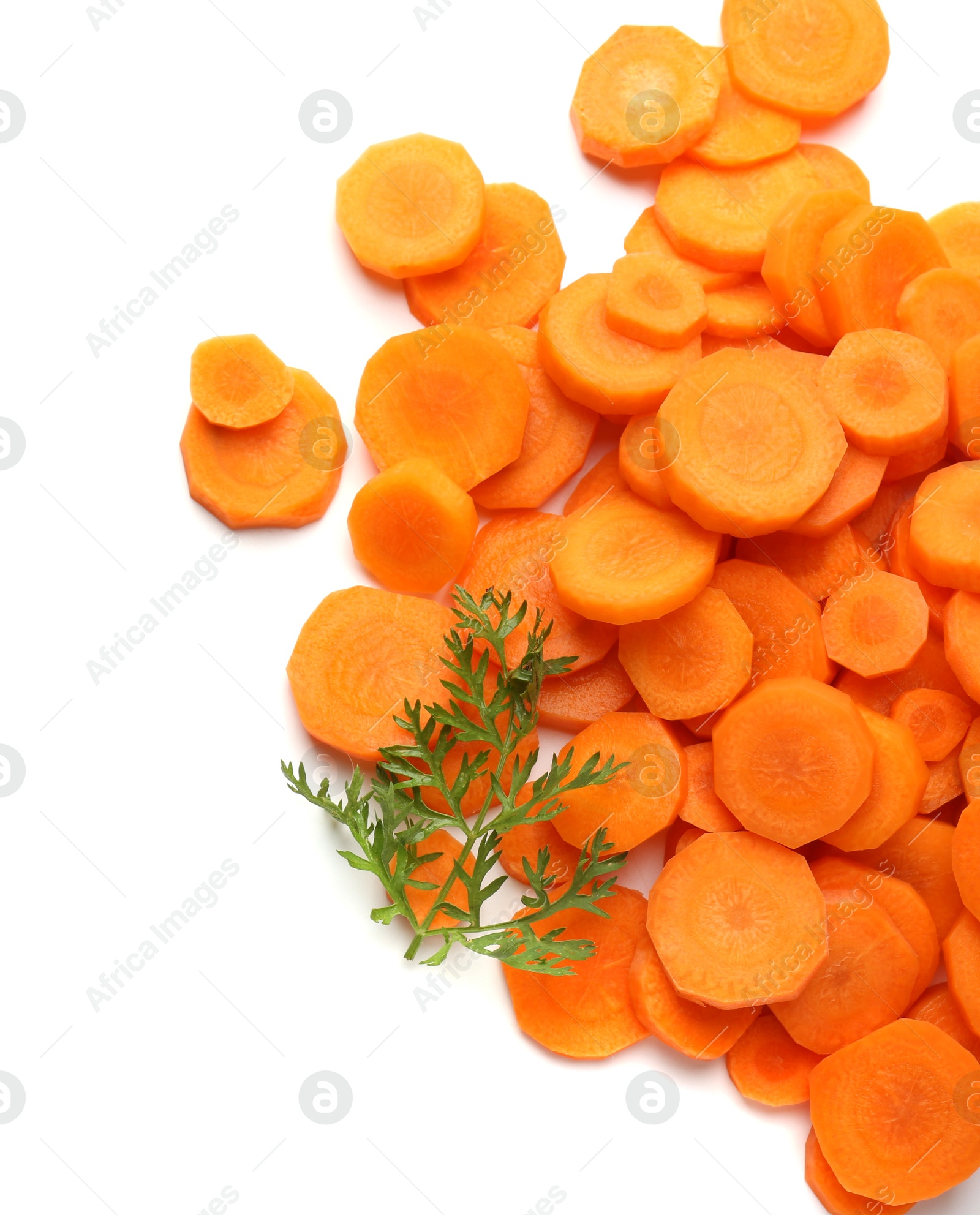 Photo of Slices of fresh ripe carrot and green leaf isolated on white, top view