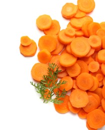 Photo of Slices of fresh ripe carrot and green leaf isolated on white, top view