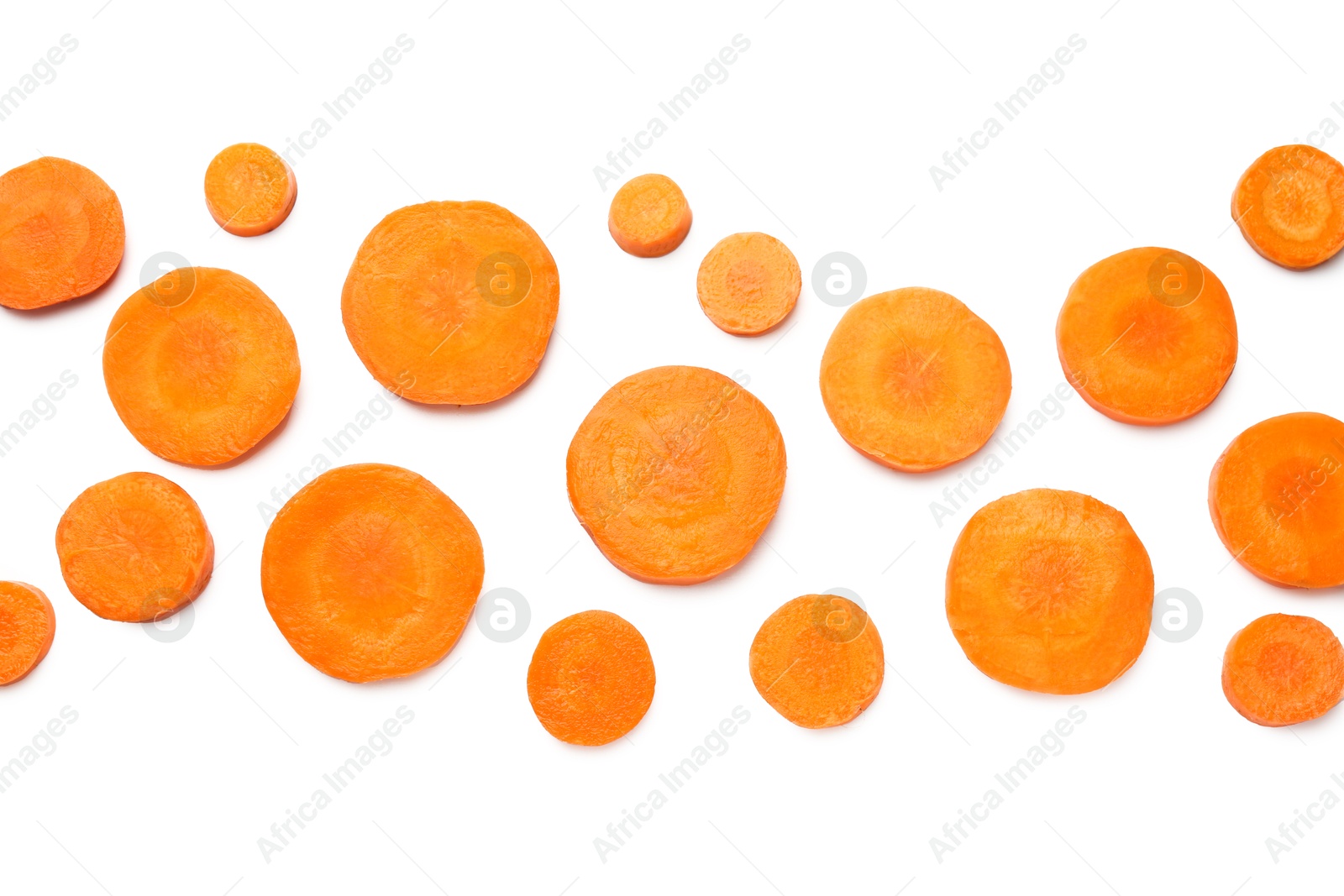 Photo of Slices of fresh ripe carrot isolated on white, top view