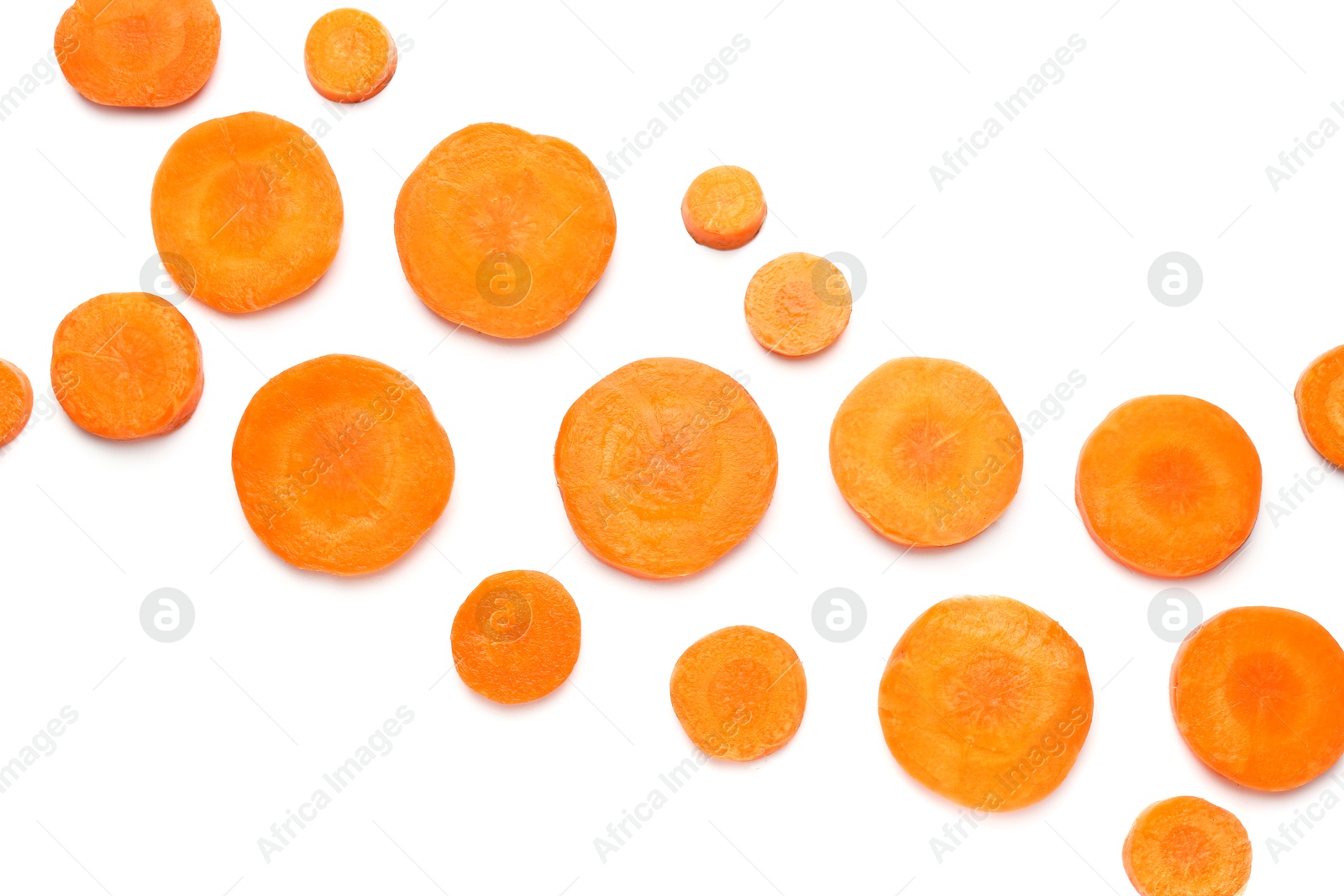 Photo of Slices of fresh ripe carrot isolated on white, top view