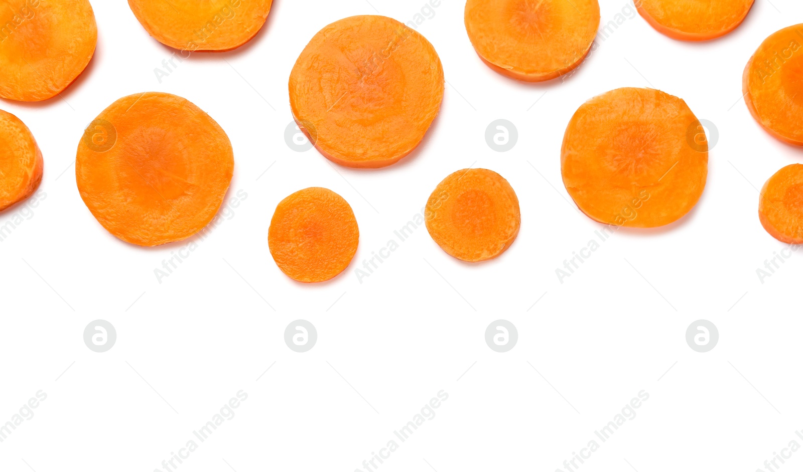 Photo of Slices of fresh ripe carrot isolated on white, top view