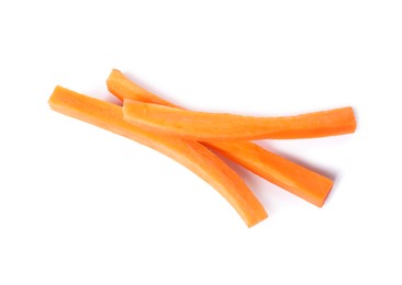 Photo of Fresh ripe carrot sticks isolated on white, above view