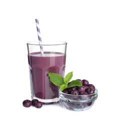 Photo of Tasty acai juice in glass, mint and berries isolated on white