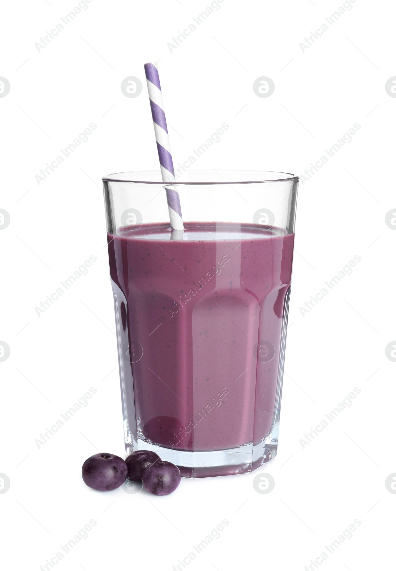 Photo of Tasty acai juice in glass and berries isolated on white