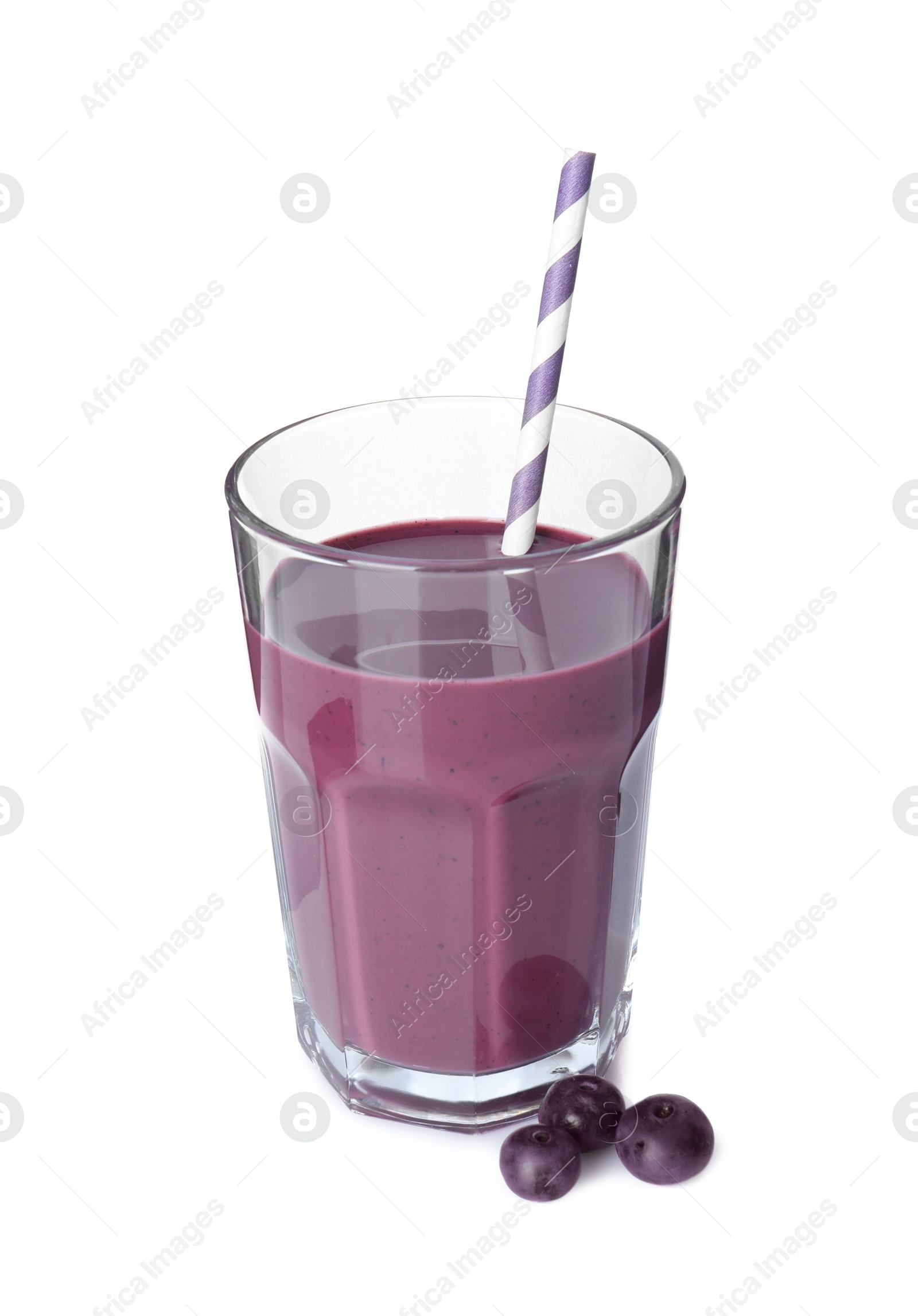 Photo of Tasty acai juice in glass and berries isolated on white