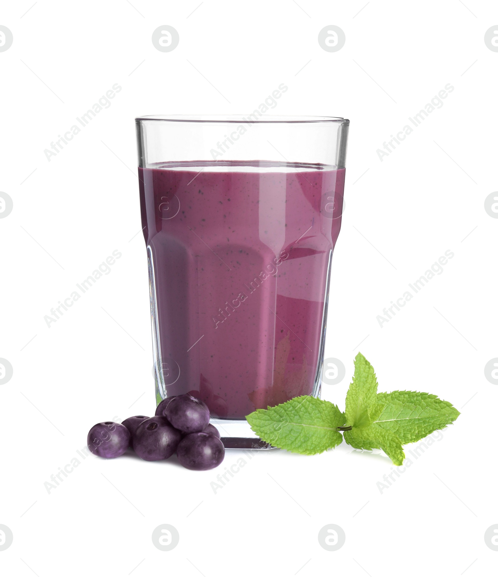 Photo of Tasty acai juice in glass, mint and berries isolated on white