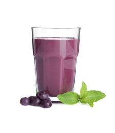 Tasty acai juice in glass, mint and berries isolated on white