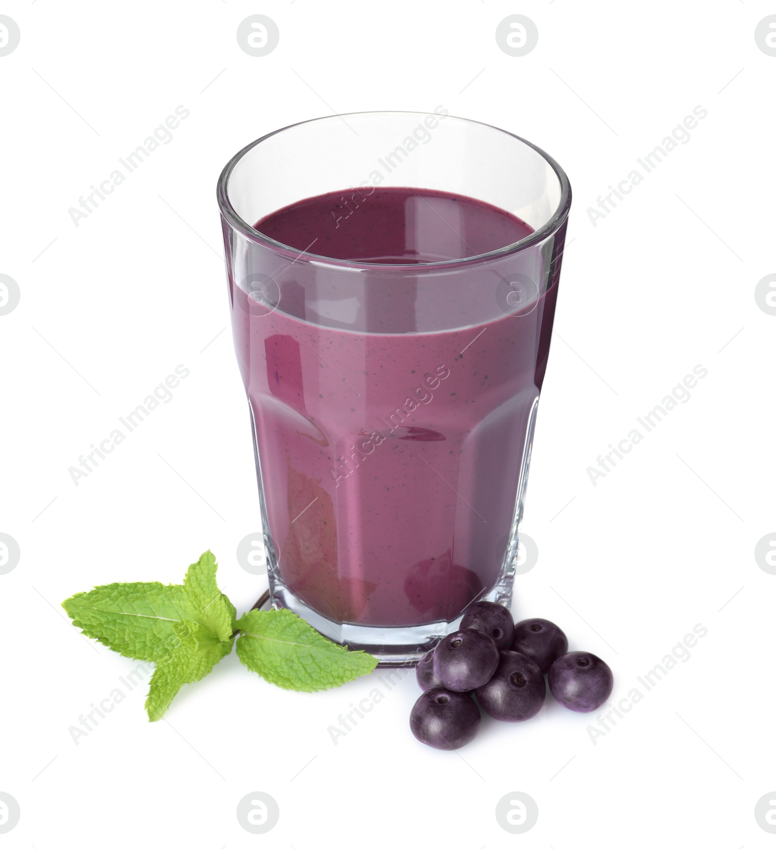 Photo of Tasty acai juice in glass, mint and berries isolated on white