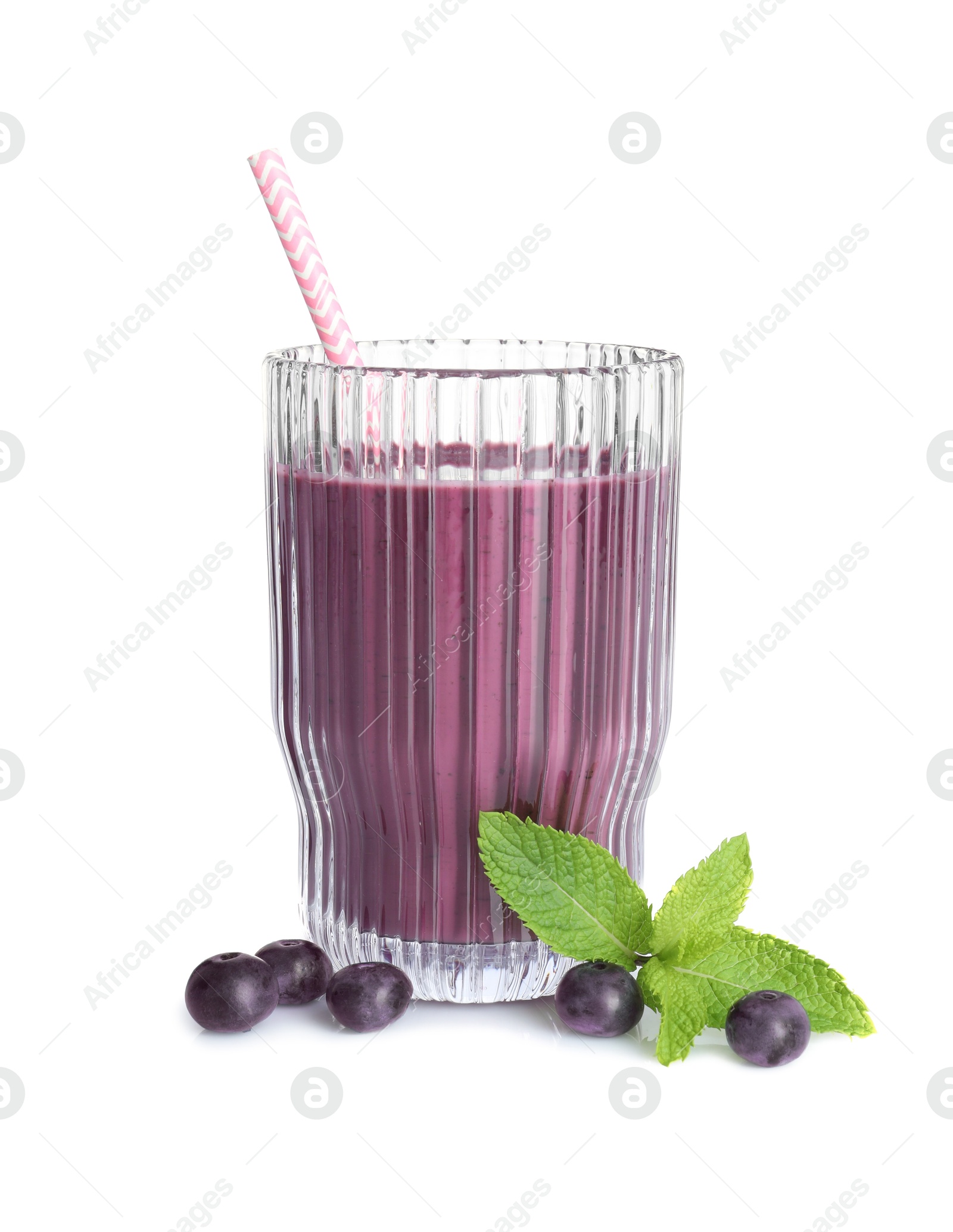 Photo of Tasty acai juice in glass, mint and berries isolated on white