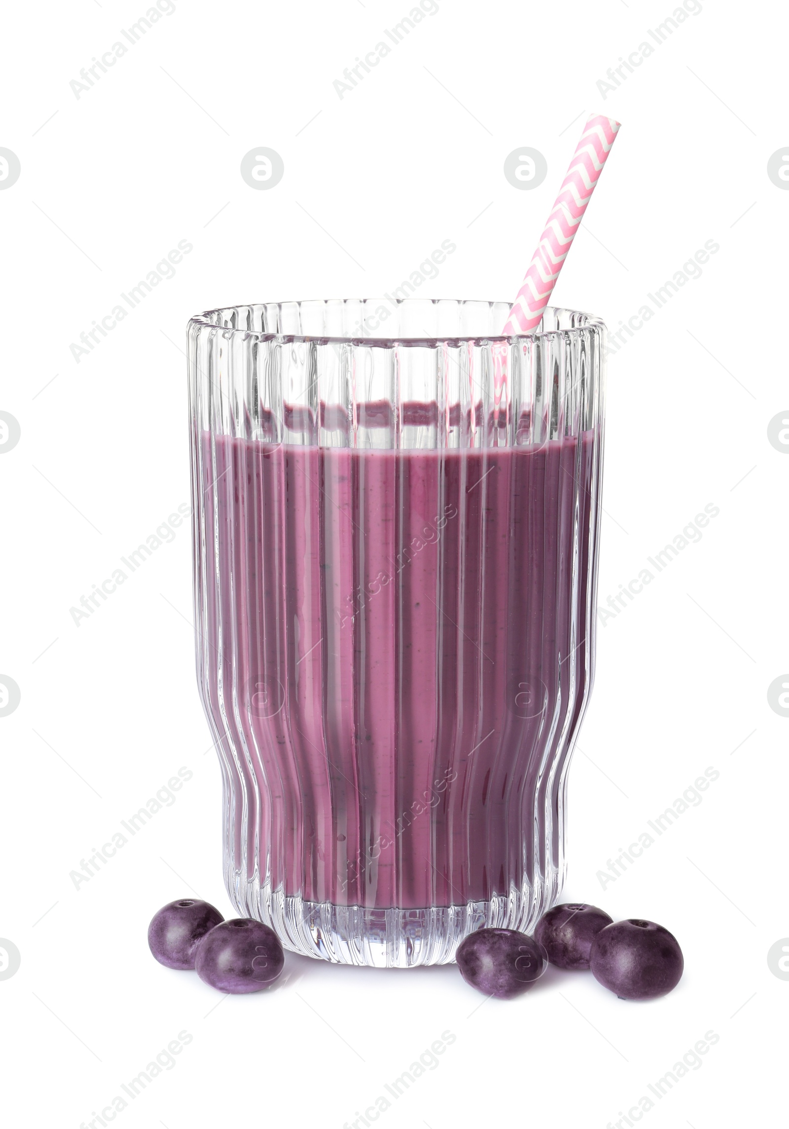 Photo of Tasty acai juice in glass and berries isolated on white