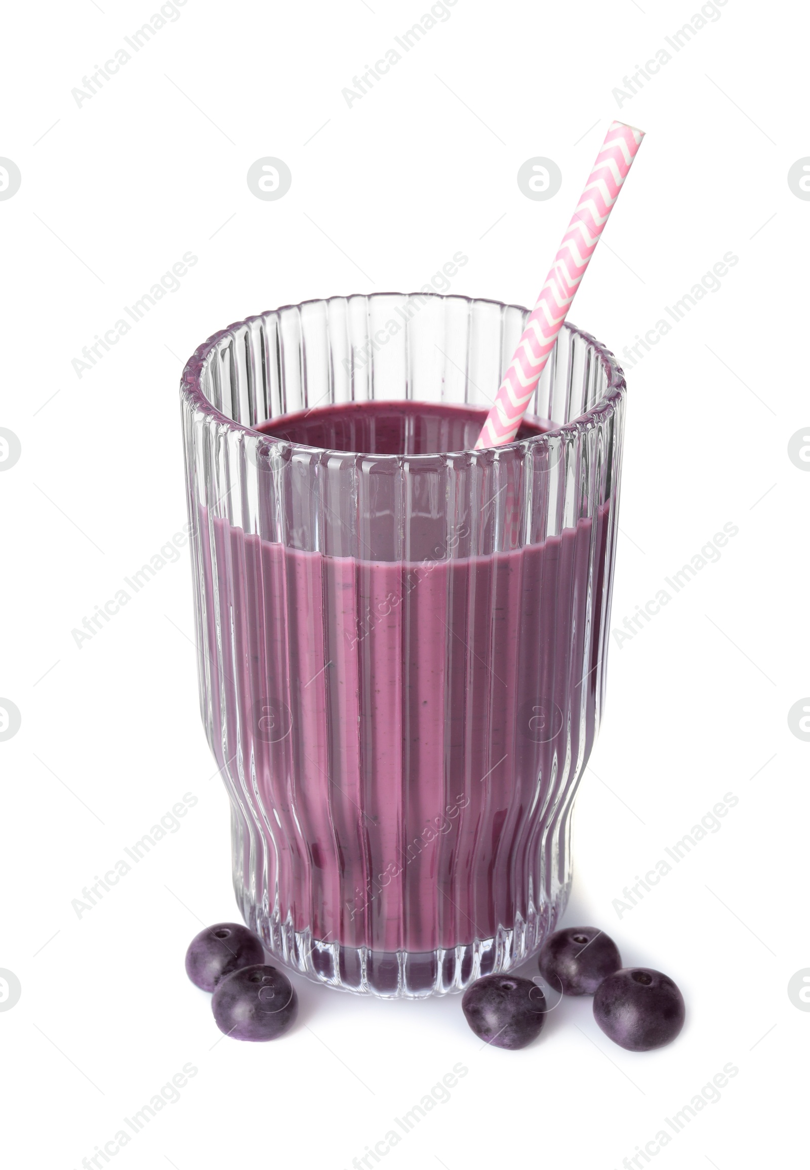 Photo of Tasty acai juice in glass and berries isolated on white