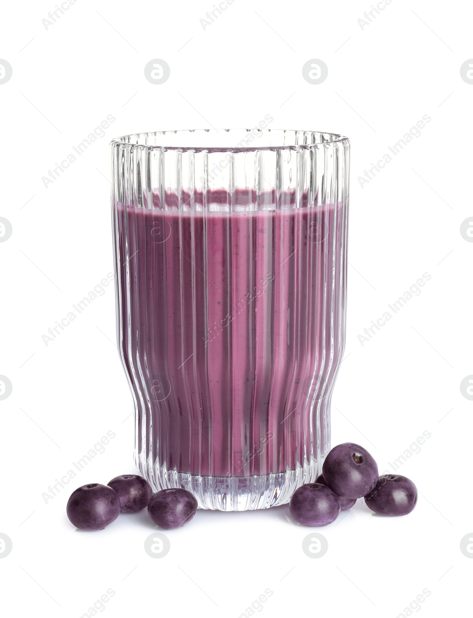 Photo of Tasty acai juice in glass and berries isolated on white