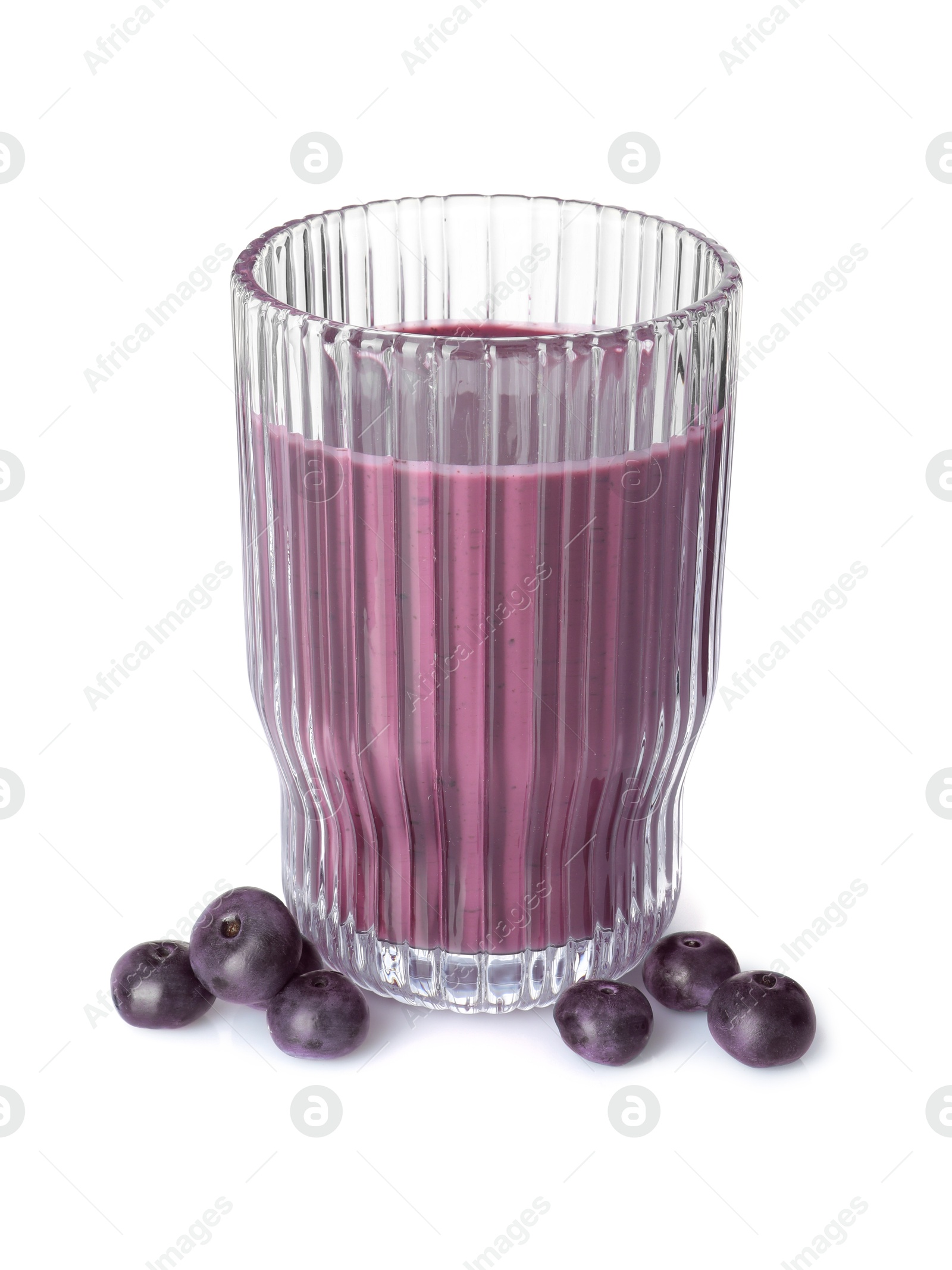 Photo of Tasty acai juice in glass and berries isolated on white