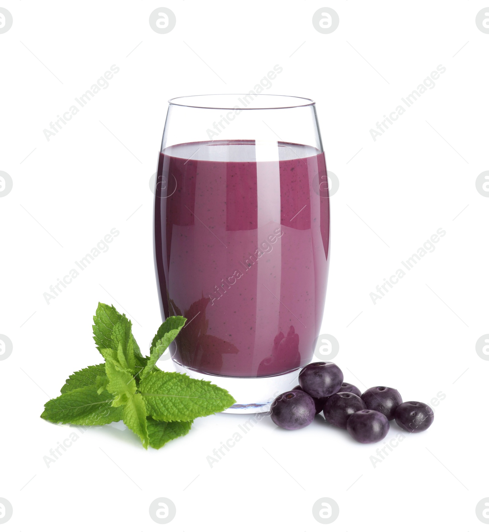 Photo of Tasty acai juice in glass, mint and berries isolated on white