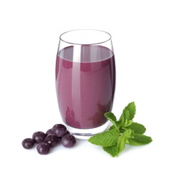 Photo of Tasty acai juice in glass, mint and berries isolated on white