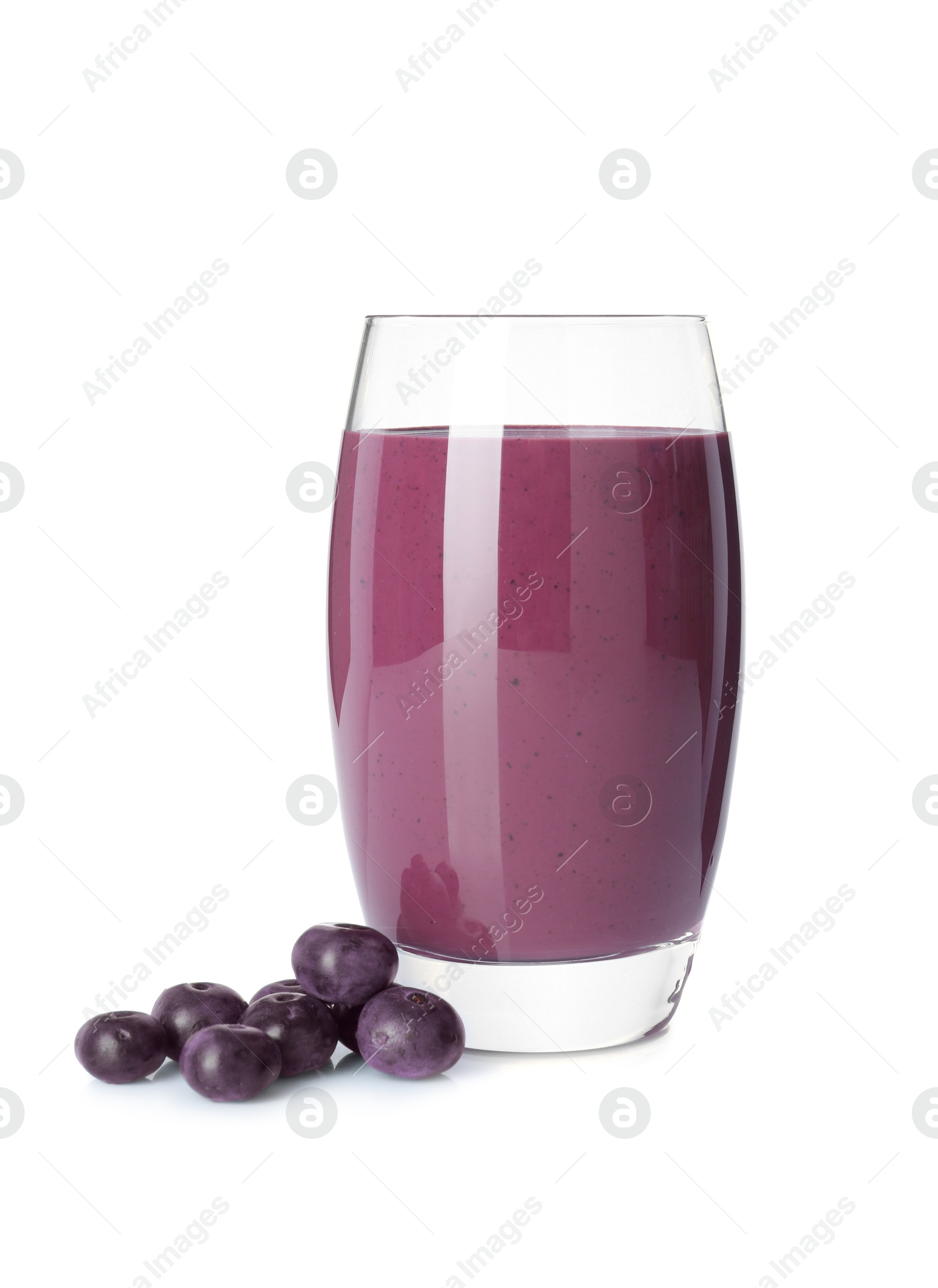 Photo of Tasty acai juice in glass and berries isolated on white