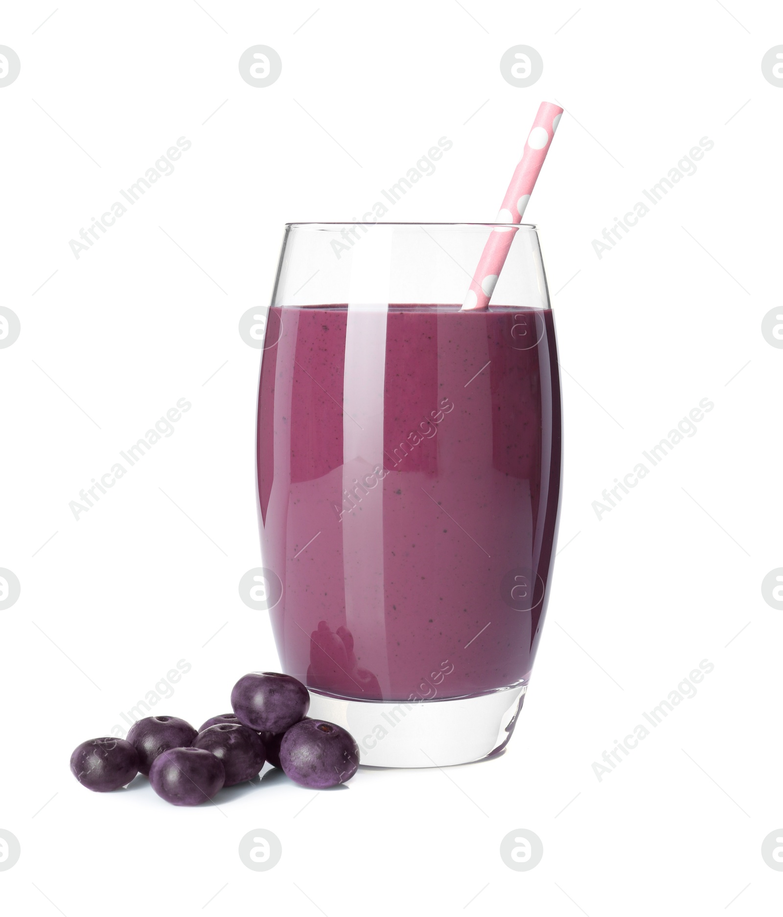 Photo of Tasty acai juice in glass and berries isolated on white