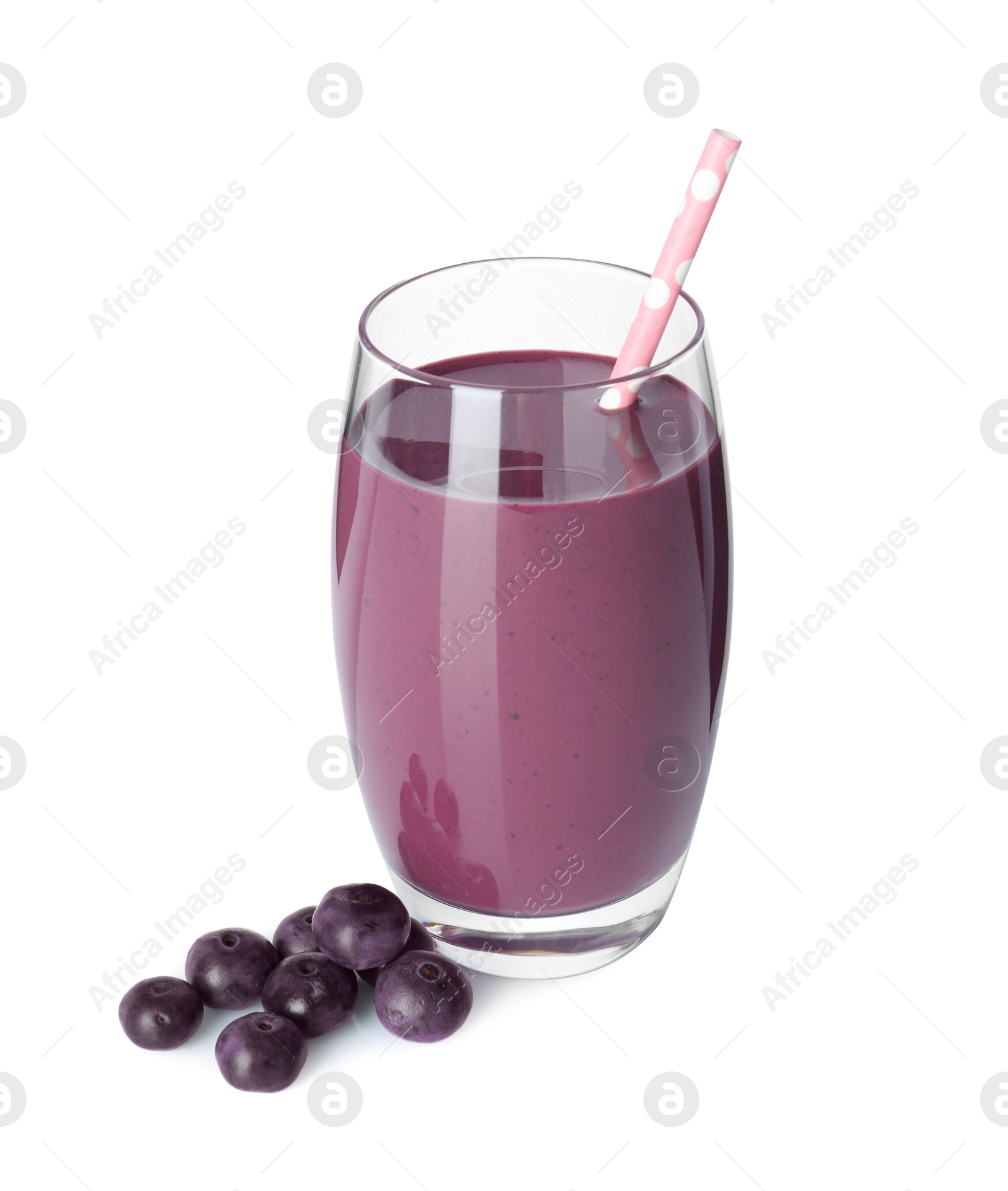 Photo of Tasty acai juice in glass and berries isolated on white