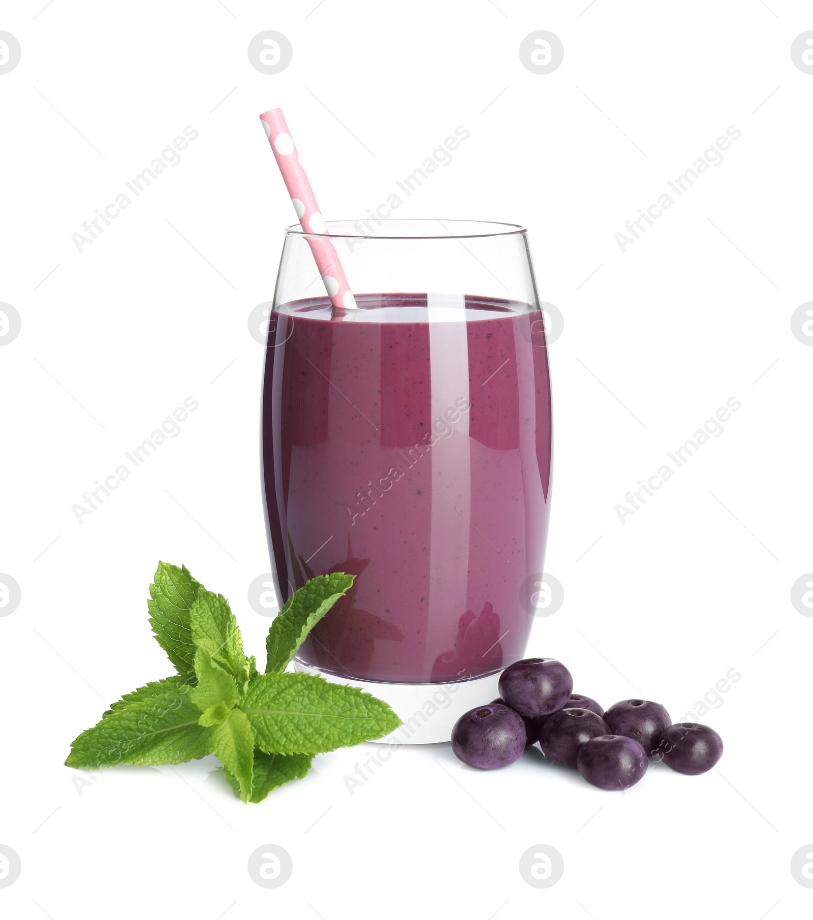 Photo of Tasty acai juice in glass, mint and berries isolated on white