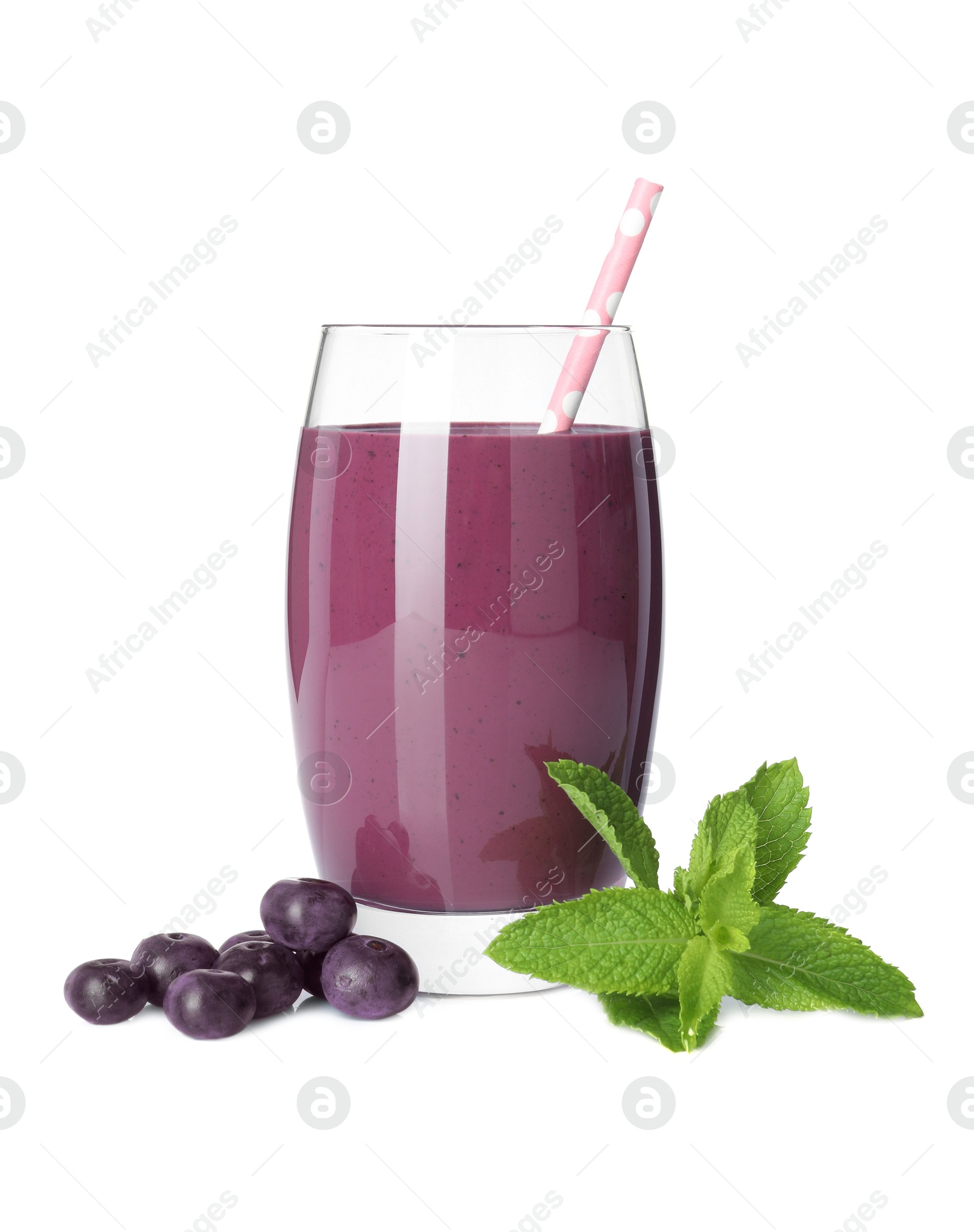 Photo of Tasty acai juice in glass, mint and berries isolated on white