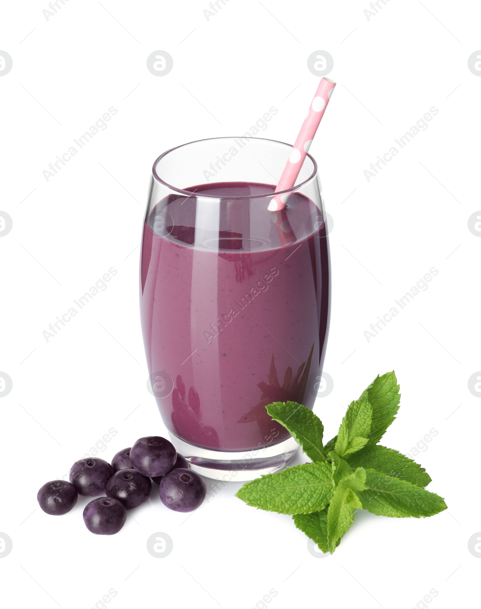 Photo of Tasty acai juice in glass, mint and berries isolated on white