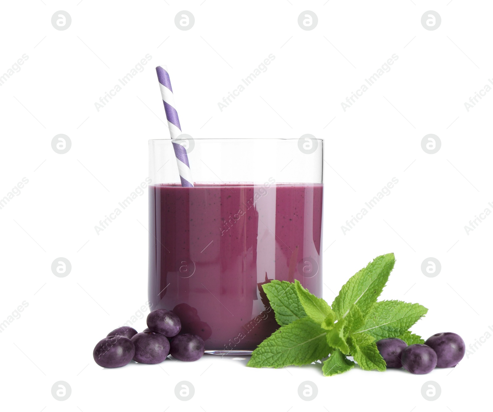 Photo of Tasty acai juice in glass, mint and berries isolated on white