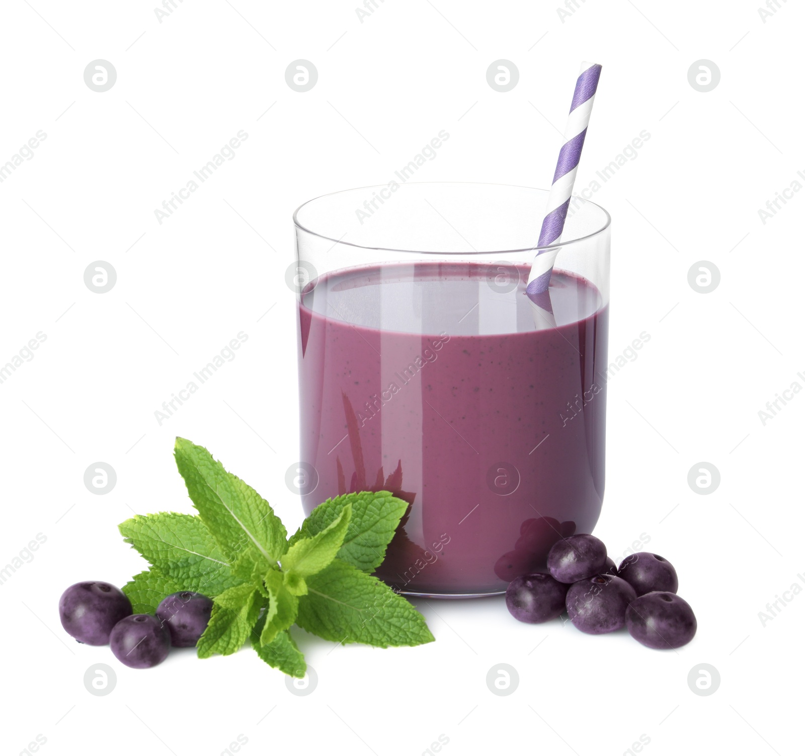 Photo of Tasty acai juice in glass, mint and berries isolated on white