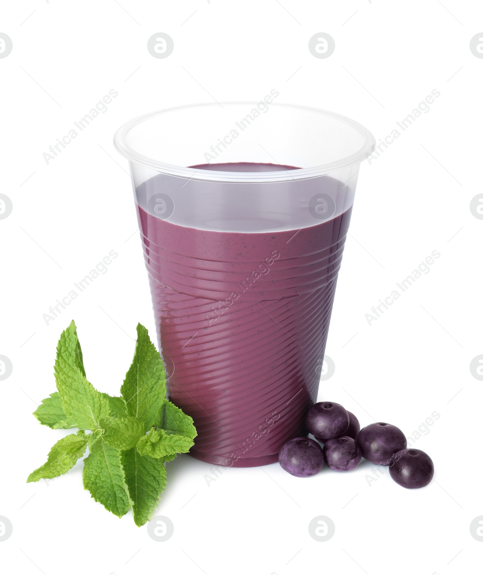 Photo of Tasty acai juice, mint and berries isolated on white