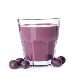 Photo of Tasty acai juice in glass and berries isolated on white